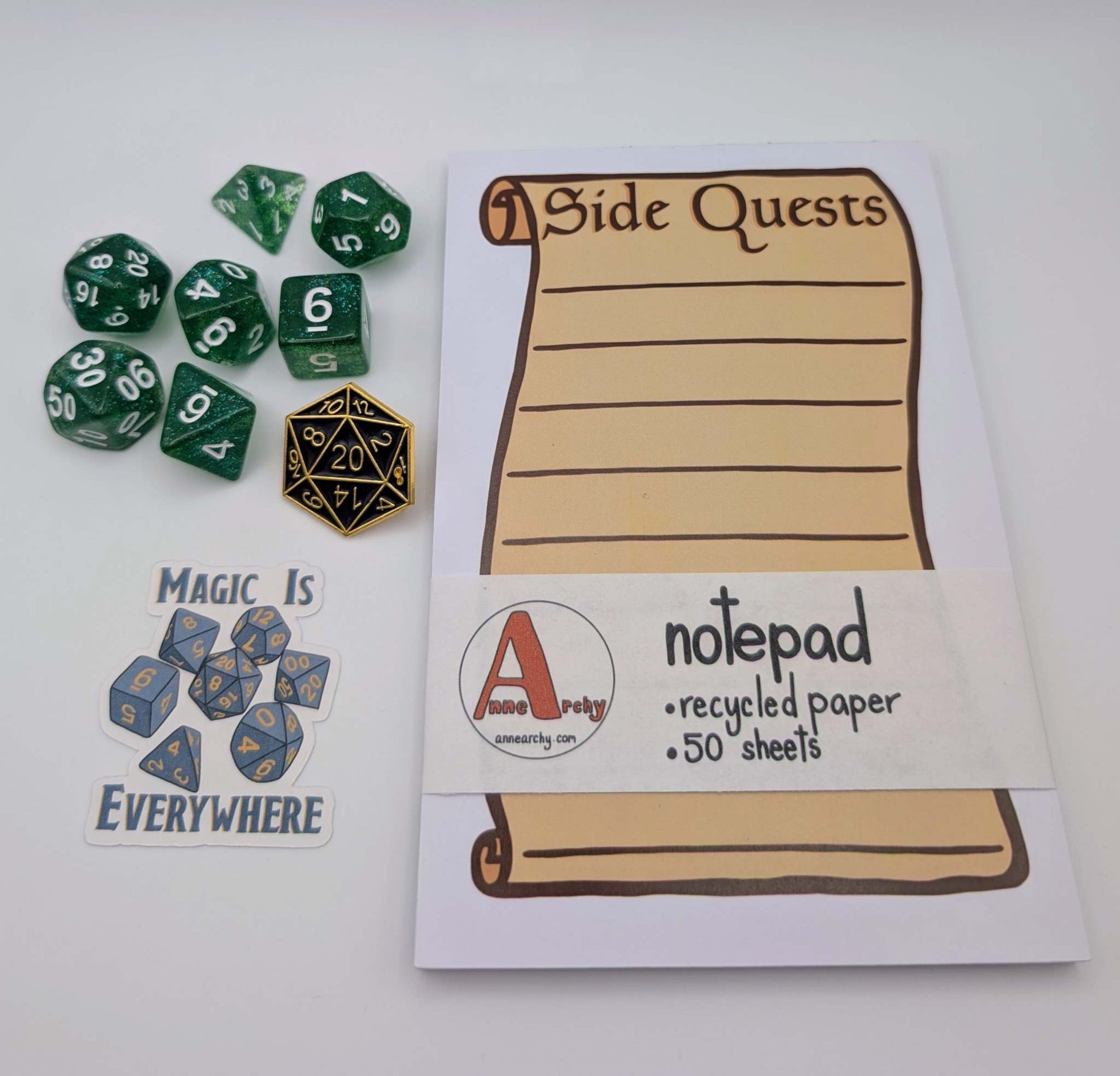 Seven piece dice set, dice sticker, dnd pin, and a notepad that says side quests