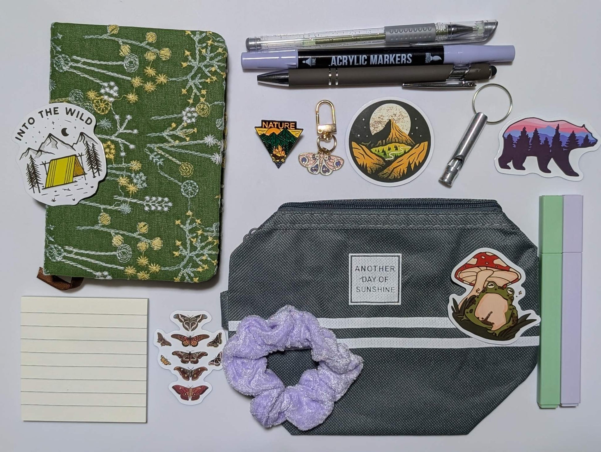 Nature Nerd Basic Bundle with green floral journal, stickers, ballpoint pen, highlighters, gel pen, markers, keychain, sticky notepad, pin, scrunchie, zippered pouch, and whistle keychain