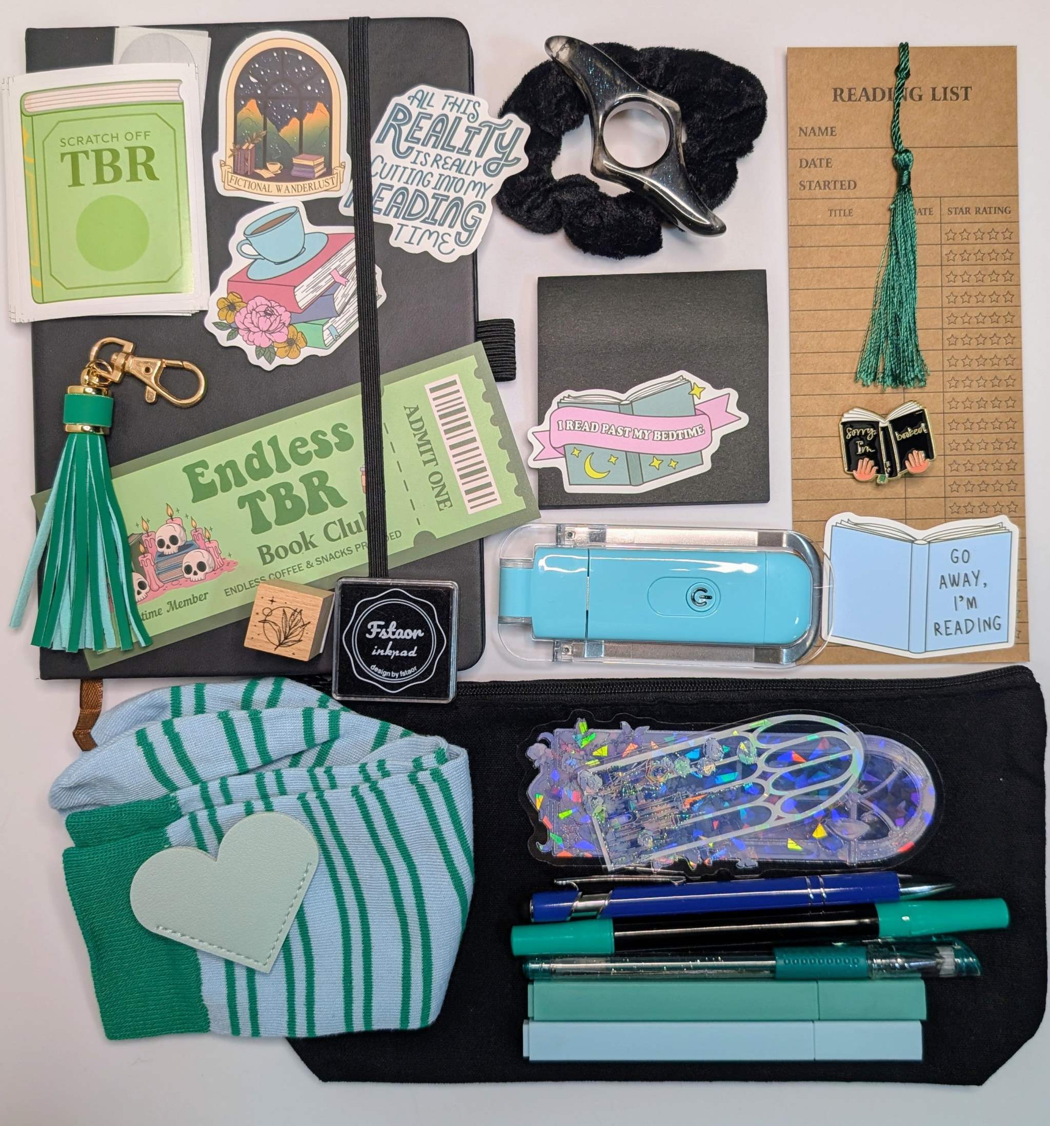 Book nerd deluxe bundle with journal, book light, socks, stamp, ink pad, TBR scratchers, stickers, keychain, bookmarks, zippered pouch, highlighters, gel pen, ballpoint pen, marker, page holder, sticky notepad, pin, scrunchie