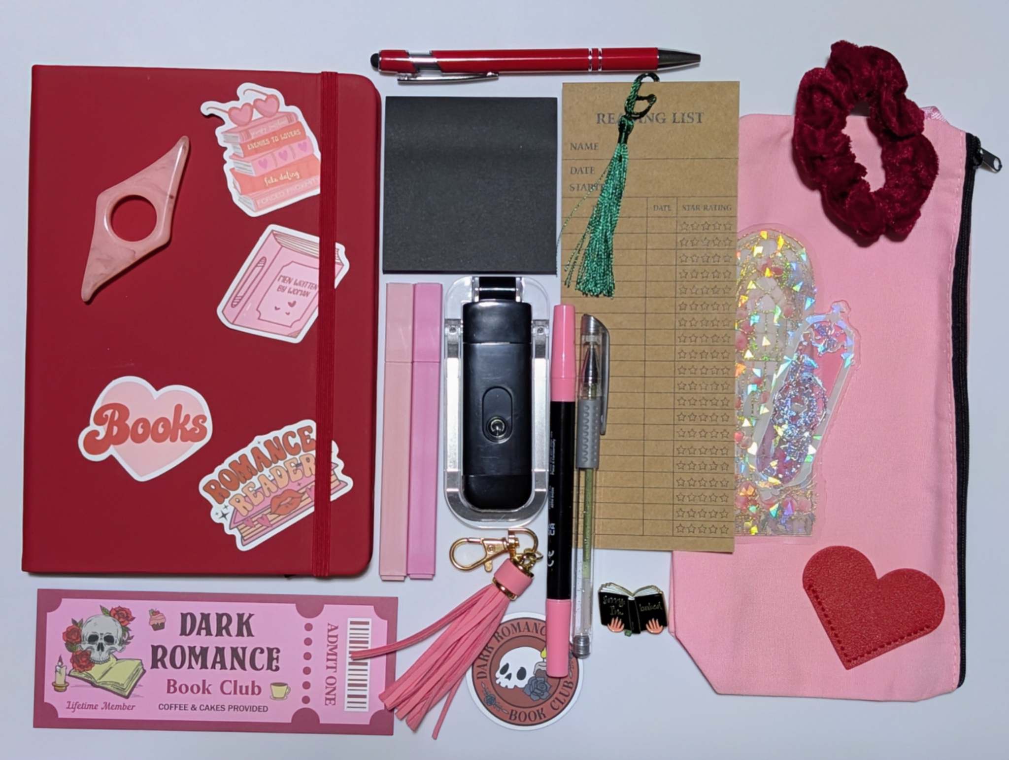 Book Nerd Basic Bundle with journal, booklight, stickers, keychain, bookmarks, highlighters, gel pen, ballpoint pen, marker, acrylic thumb page holder, sticky notepad, zippered pouch, pin, and scrunchie