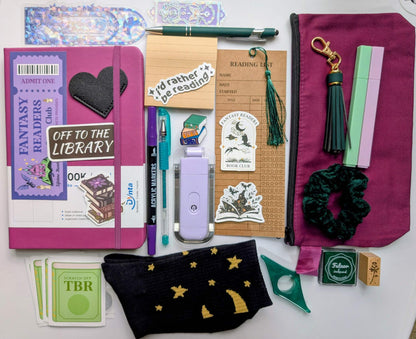 Book nerd deluxe bundle with journal, book light, socks, stamp, ink pad, TBR scratchers, stickers, keychain, bookmarks, zippered pouch, highlighters, gel pen, ballpoint pen, marker, page holder, sticky notepad, pin, scrunchie