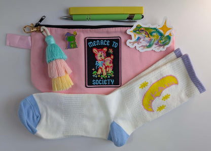 pastel mini bundle with socks, zipper pouch, keychain, sticker, and frog pin