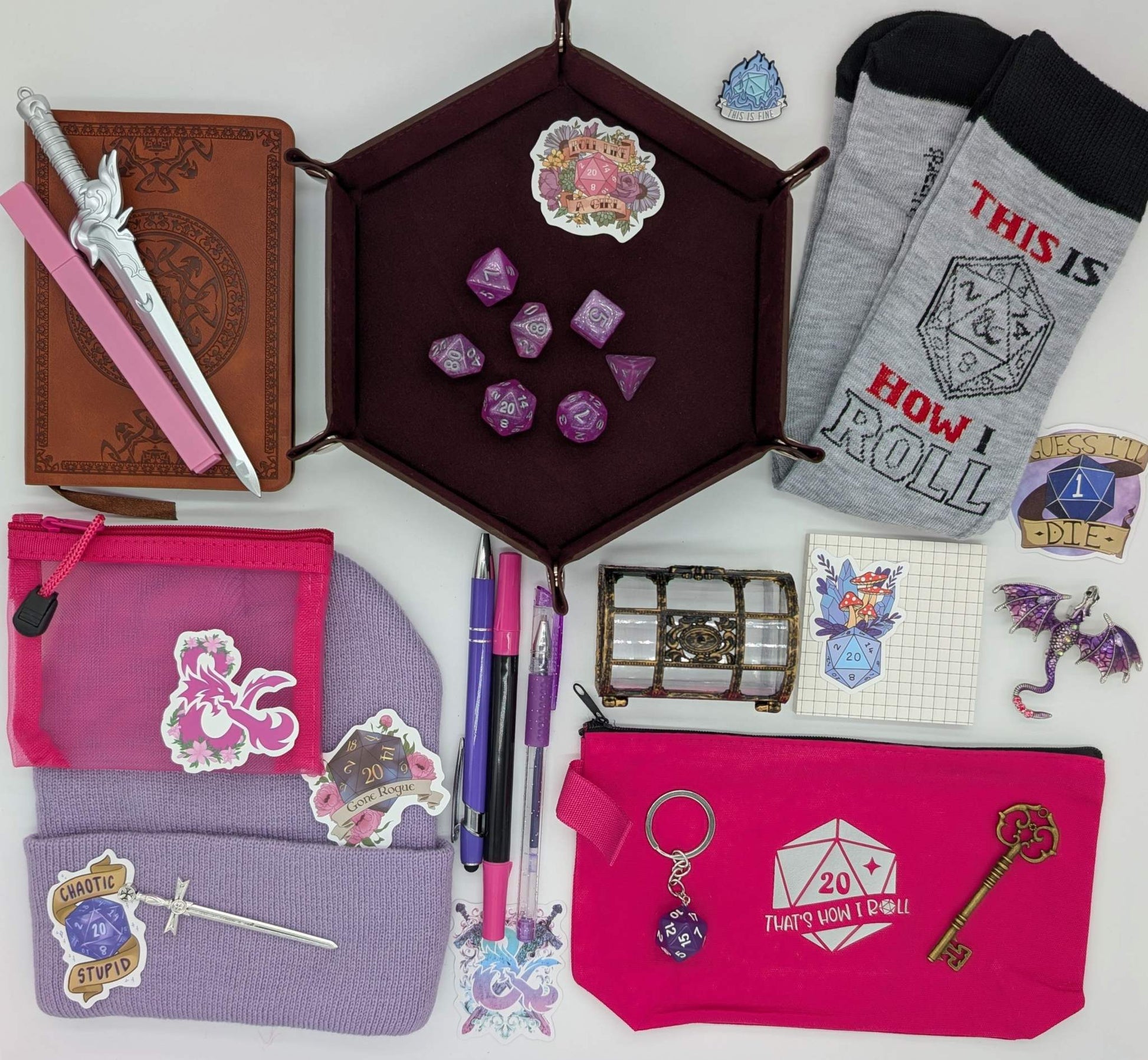 DnD nerd legendary bundle with vintage style notebook, ballpoint pen, gel pen, highlighter, marker, sticky notepad, D20 keychain, sword pen, zippered pouch, pin, stickers, key, sword bookmark, dice set, socks, dice mat, dragon pin, treasure chest, beanie, mesh pouch