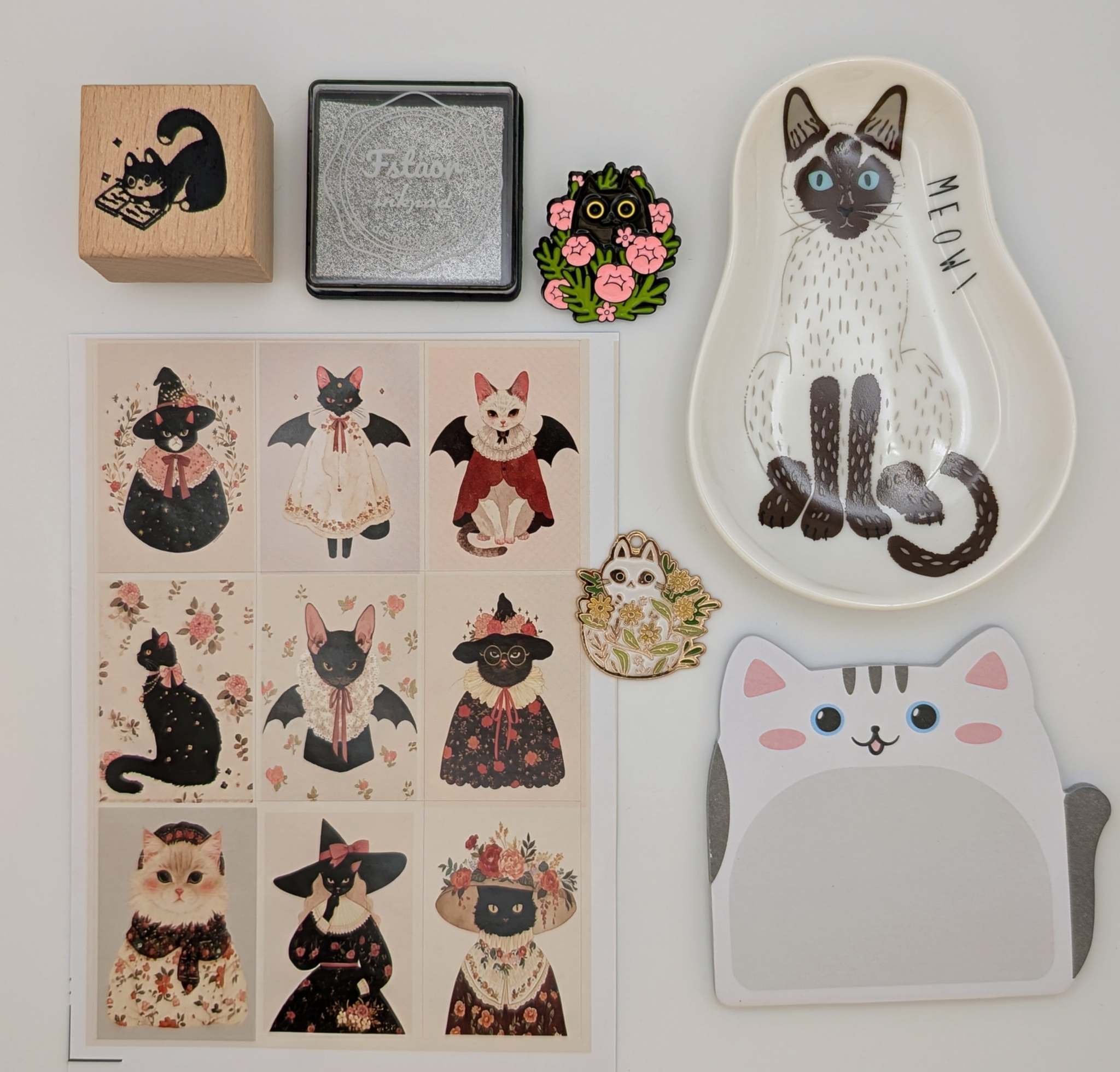 Cat sticky notes, cat ceramic trinket dish, cat sticker sheet, cat charm, cat pin, cat rubber stamp, ink pad