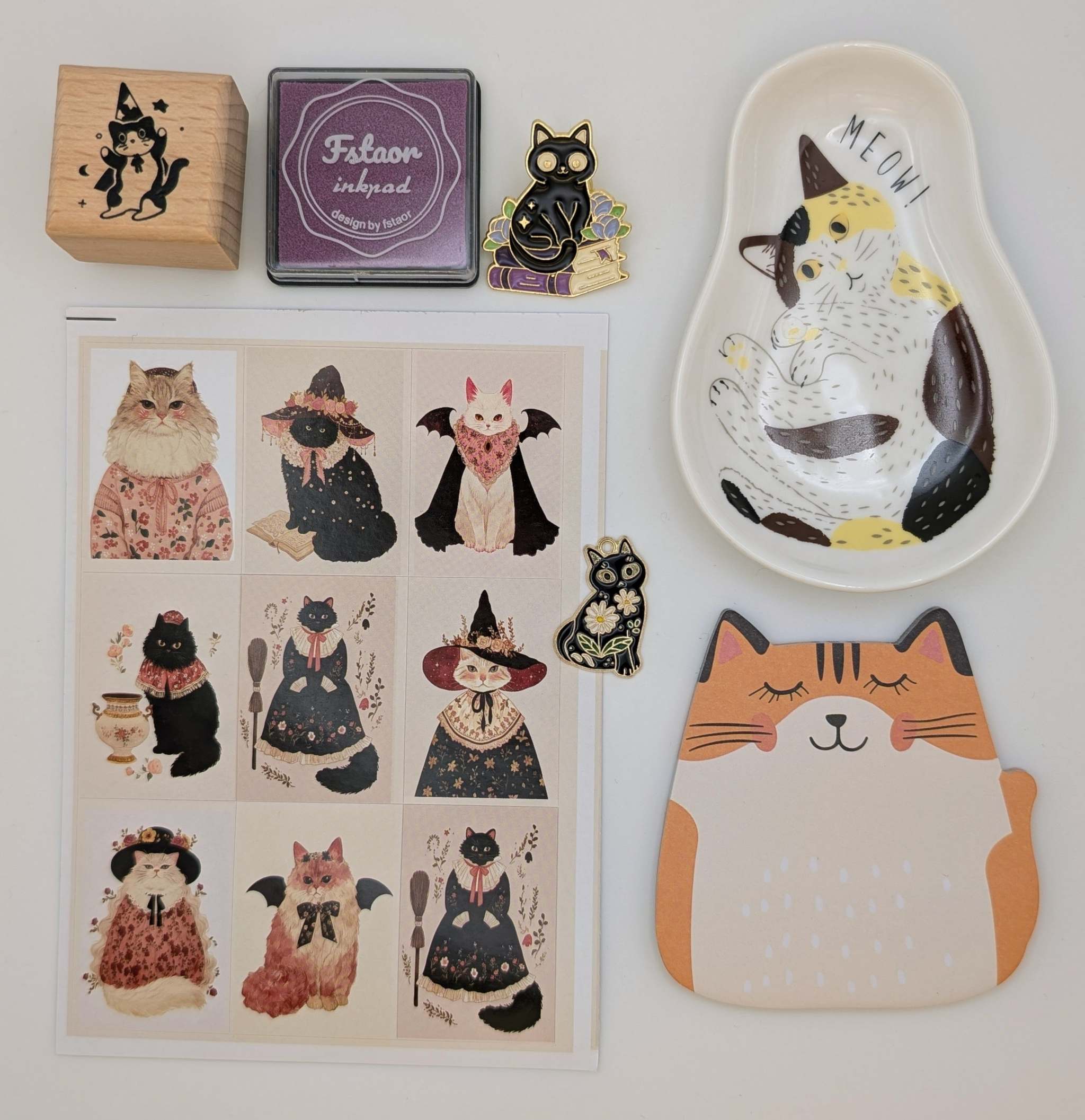 Cat sticky notes, cat ceramic trinket dish, cat sticker sheet, cat charm, cat pin, cat rubber stamp, ink pad