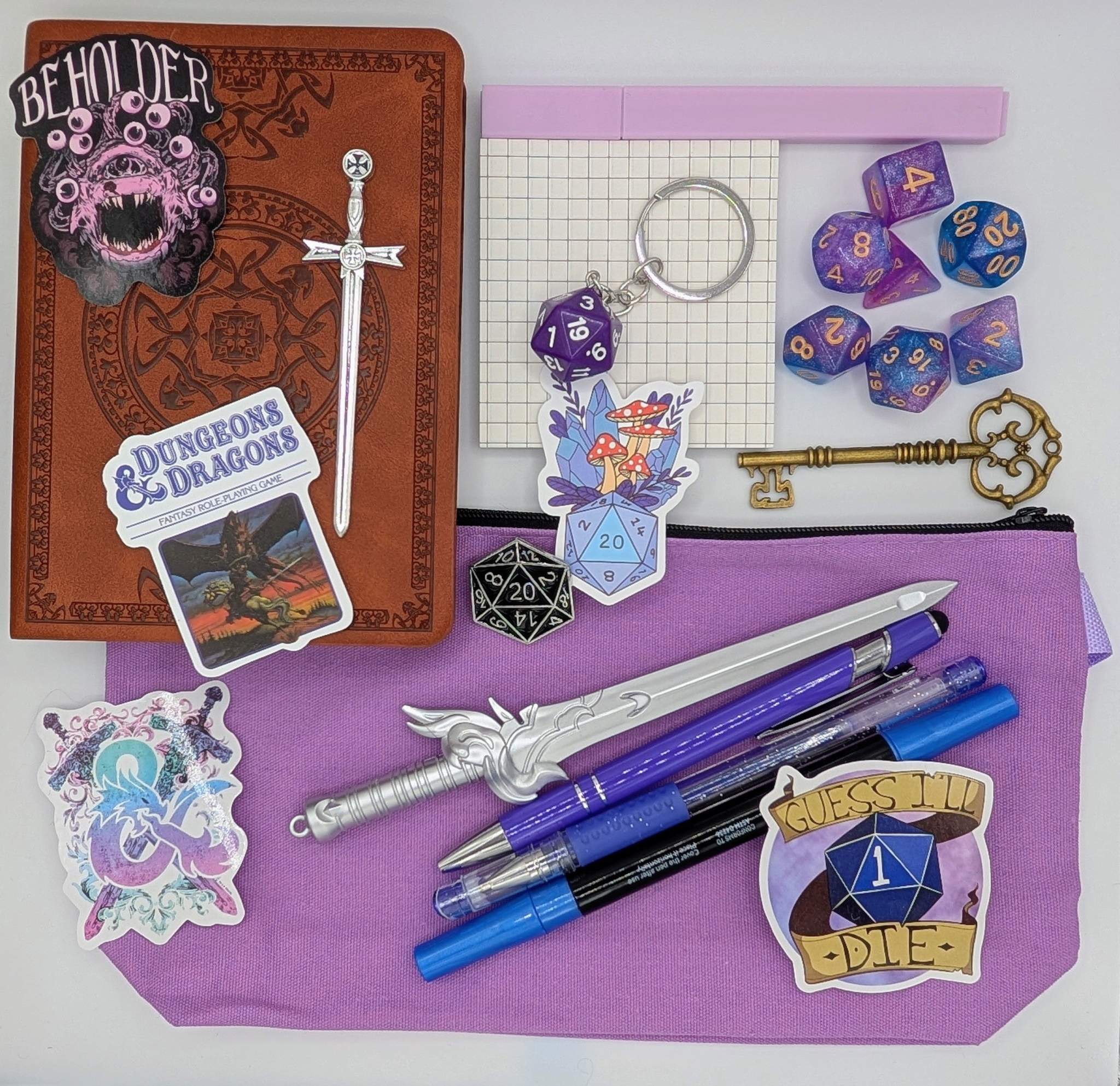 Translation missing: en.DnD nerd basic bundle with a vintage style notebook, ballpoint pen, gel pen, highlighter, marker, sticky notepad, D20 keychain, sword pen, zippered pouch, pin, stickers, key, sword bookmark, and dice set